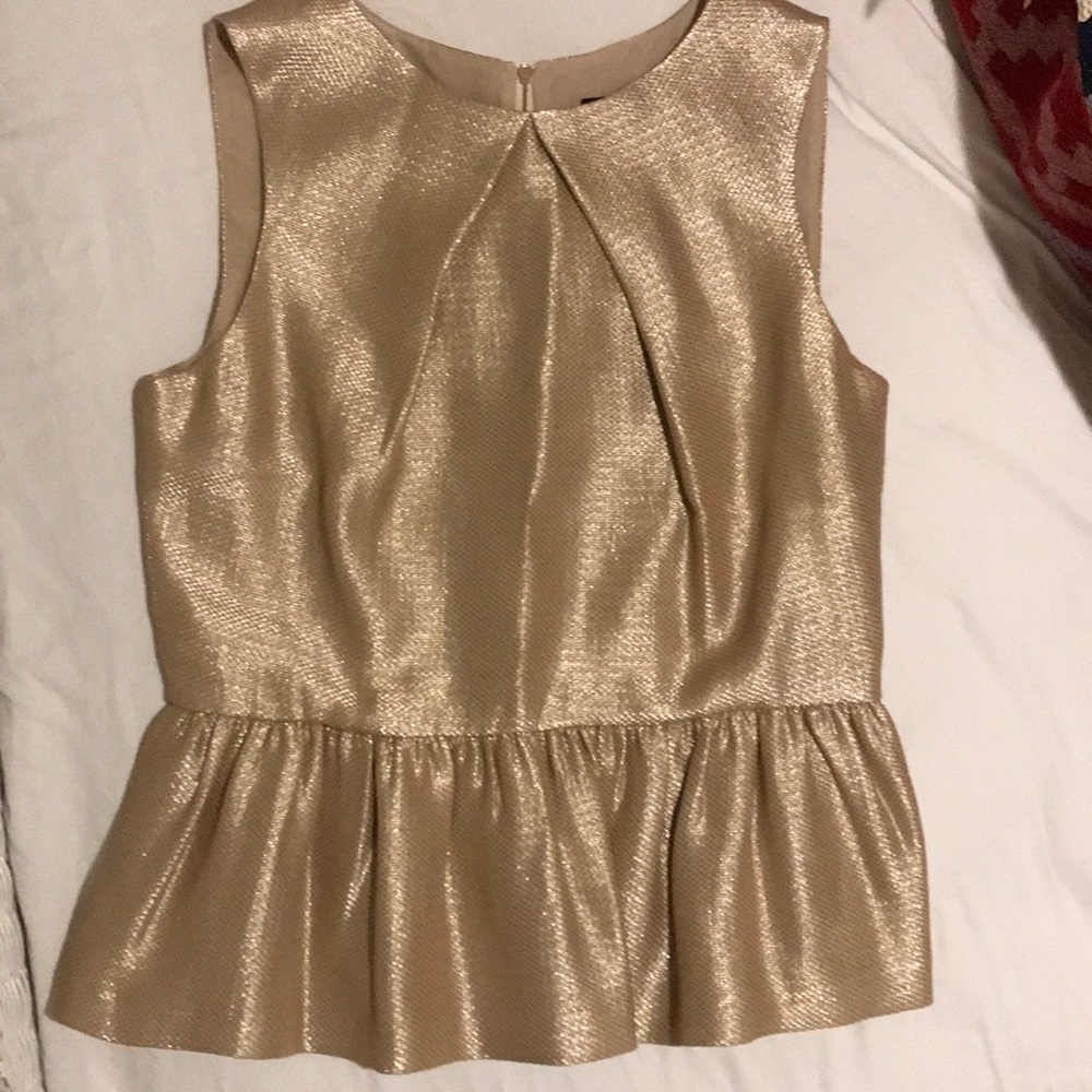 Mulberry shimmery gold sleeveless top.